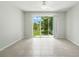 A bright, airy room with large sliding doors that provide backyard views and ample natural light at 5110 Sylvester Loop, Tampa, FL 33610