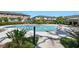 Resort-style community pool surrounded by lush landscaping and comfortable lounge seating for residents at 5110 Sylvester Loop, Tampa, FL 33610