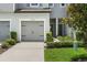 Landscaped exterior with well-manicured bushes and a driveway leading to a single-car garage at 5110 Sylvester Loop, Tampa, FL 33610