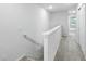 Hallway view features neutral walls, carpeted floors and white trim at 5110 Sylvester Loop, Tampa, FL 33610