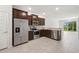 An open kitchen features stainless steel appliances and provides natural light at 5110 Sylvester Loop, Tampa, FL 33610