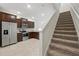 Features an open-concept layout, stainless steel appliances, and dark wood cabinets at 5110 Sylvester Loop, Tampa, FL 33610