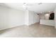 Bright living room features a ceiling fan and open floor plan to the kitchen at 5110 Sylvester Loop, Tampa, FL 33610