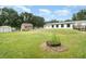 Sprawling backyard with storage sheds and ample space for outdoor activities at 5613 Forest Creek Rd, Lakeland, FL 33810