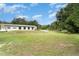 Expansive backyard featuring mature trees and a clear view of the property at 5613 Forest Creek Rd, Lakeland, FL 33810