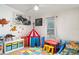 Colorful bedroom featuring a themed bed, play area, and ample storage at 5613 Forest Creek Rd, Lakeland, FL 33810