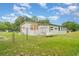 Fenced in single-story home with a green lawn, propane tank and room to roam at 5613 Forest Creek Rd, Lakeland, FL 33810