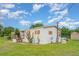 Single story home displaying vinyl siding with colorful shutter accents, and a storage shed in backyard at 5613 Forest Creek Rd, Lakeland, FL 33810