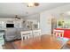 Open-concept living and dining area with wood floors and ceiling fans at 5613 Forest Creek Rd, Lakeland, FL 33810