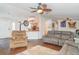 Comfortable living room with hardwood floors, opening to the kitchen with a breakfast bar at 5613 Forest Creek Rd, Lakeland, FL 33810