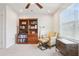 Inviting space with bookshelf, cozy chair, ottoman and a trunk for added storage at 5808 Grand Sonata Ave, Lutz, FL 33558