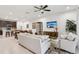 Open-concept living area connecting to the kitchen, featuring modern furnishings and plenty of natural light at 5808 Grand Sonata Ave, Lutz, FL 33558