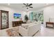 Comfortable living room with sleek furniture, large windows, neutral colors, and access to the patio at 5808 Grand Sonata Ave, Lutz, FL 33558