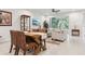 Open-concept living space with dining area and living room connected, showcasing modern furnishings at 5808 Grand Sonata Ave, Lutz, FL 33558