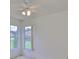 Corner bedroom with neutral carpet and views from two windows at 602 Deep Lake Ln, Sun City Center, FL 33573