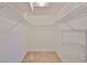 Walk-in closet with shelving for ample storage space at 602 Deep Lake Ln, Sun City Center, FL 33573