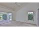 Bright main bedroom with sliding glass door to patio and large window at 602 Deep Lake Ln, Sun City Center, FL 33573