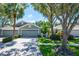 Charming home exterior with manicured landscaping, a two-car garage, and inviting curb appeal at 6044 Sandhill Ridge Dr, Lithia, FL 33547