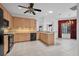 Open concept kitchen with sleek appliances, plenty of counter space and neutral-tone cabinets at 6044 Sandhill Ridge Dr, Lithia, FL 33547