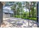 Spacious screened-in lanai offering serene views of the lush backyard and greenery at 6044 Sandhill Ridge Dr, Lithia, FL 33547