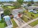 Aerial shot of a home with well-kept lawn, colorful landscaping, and an attached garage at 6167 31St Ave, St Petersburg, FL 33710