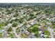 The aerial view reveals a community dotted with mature trees and a variety of home styles at 6167 31St Ave, St Petersburg, FL 33710