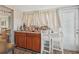 Charming bar area with wood cabinetry, countertop space, and seating, perfect for entertaining at 6167 31St Ave, St Petersburg, FL 33710