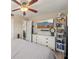 Bedroom with modern fan, dresser, and shelving at 6167 31St Ave, St Petersburg, FL 33710