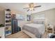 Cozy bedroom with natural light featuring wood floors, a modern bed frame, and neutral decor at 6167 31St Ave, St Petersburg, FL 33710