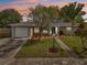 Charming single-story home with a manicured lawn, inviting curb appeal and updated landscaping at 6167 31St Ave, St Petersburg, FL 33710