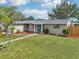 Beautifully landscaped front yard with a well-maintained lawn and a welcoming walkway at 6167 31St Ave, St Petersburg, FL 33710