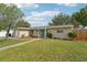 Well-maintained home with a lush lawn, colorful landscaping, and a welcoming entrance at 6167 31St Ave, St Petersburg, FL 33710