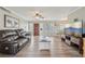 Spacious living room with wood floors, a ceiling fan, and views into the dining area at 6167 31St Ave, St Petersburg, FL 33710