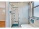 Bathroom with shower/tub combo and blue and white tile at 6237 50Th N Ave, St Petersburg, FL 33709
