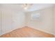 Neutral bedroom with ceiling fan and light wood floors at 6237 50Th N Ave, St Petersburg, FL 33709