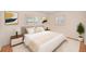 Serene bedroom with neutral tones, white bedding, and ample natural light at 6237 50Th N Ave, St Petersburg, FL 33709