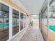 Covered patio with view of pool and doors to living room at 6237 50Th N Ave, St Petersburg, FL 33709