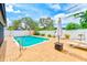 Inviting in-ground pool surrounded by a paved patio and white fencing, perfect for relaxation at 6237 50Th N Ave, St Petersburg, FL 33709