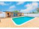 Backyard with a private pool, brick pavers, and a covered patio for outdoor entertaining at 6237 50Th N Ave, St Petersburg, FL 33709