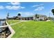 Waterfront backyard with long dock, green lawn, and sparkling pool offers an inviting outdoor living space at 6334 Cocoa Ln, Apollo Beach, FL 33572