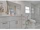 Bright and modern bathroom with marble floors, vanity, and glass shower enclosure at 6334 Cocoa Ln, Apollo Beach, FL 33572