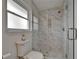 Clean and updated bathroom with a glass-enclosed shower and tiled walls at 6334 Cocoa Ln, Apollo Beach, FL 33572