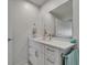 Stylish bathroom featuring white cabinets, quartz countertops, and updated fixtures at 6334 Cocoa Ln, Apollo Beach, FL 33572