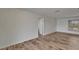 Bright bedroom with wood-look flooring and natural light from window at 6334 Cocoa Ln, Apollo Beach, FL 33572