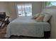 Inviting bedroom with views of the pool and waterway, featuring a comfortable bed and tv at 6334 Cocoa Ln, Apollo Beach, FL 33572