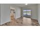 Dining area with sliding glass doors to the patio, light wood floors, and kitchen access at 6334 Cocoa Ln, Apollo Beach, FL 33572