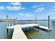 Waterfront features a private wooden dock with a platform for easy water access and scenic views at 6334 Cocoa Ln, Apollo Beach, FL 33572