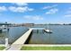 Waterfront view showcases a wooden dock and serene water, offering a picturesque and relaxing setting at 6334 Cocoa Ln, Apollo Beach, FL 33572