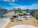 Waterfront home features a two-car garage, landscaping, and charming curb appeal in a waterfront community at 6334 Cocoa Ln, Apollo Beach, FL 33572