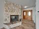 Foyer view featuring the beautiful stone fireplace and double front doors at 6334 Cocoa Ln, Apollo Beach, FL 33572